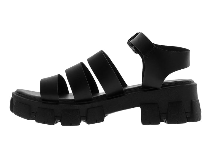 Sandalia negra con suela track gruesa y correas ajustables con hebilla plateada.