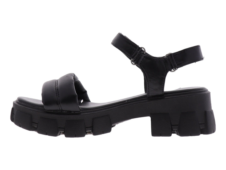 Sandalia negra de plataforma con suela track y correas ajustables.