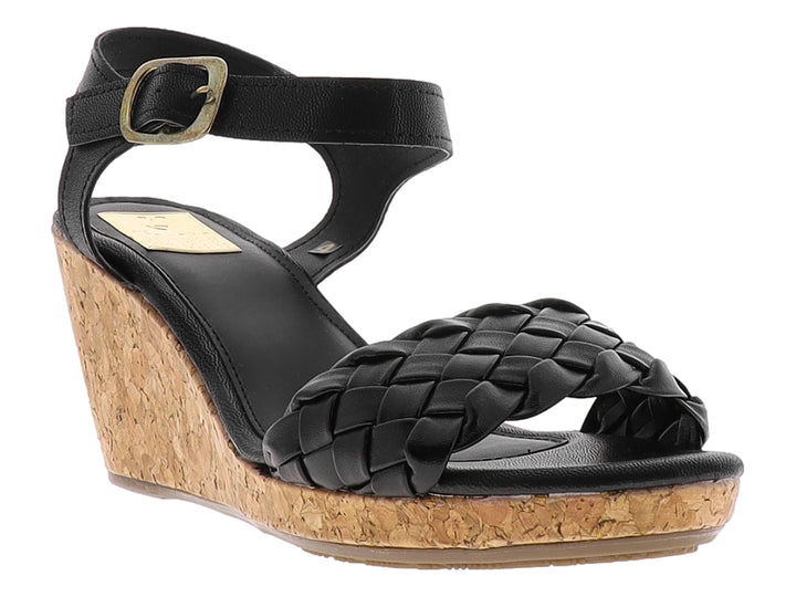 Sandalia de cuña color negro con correa trenzada y plataforma de corcho.