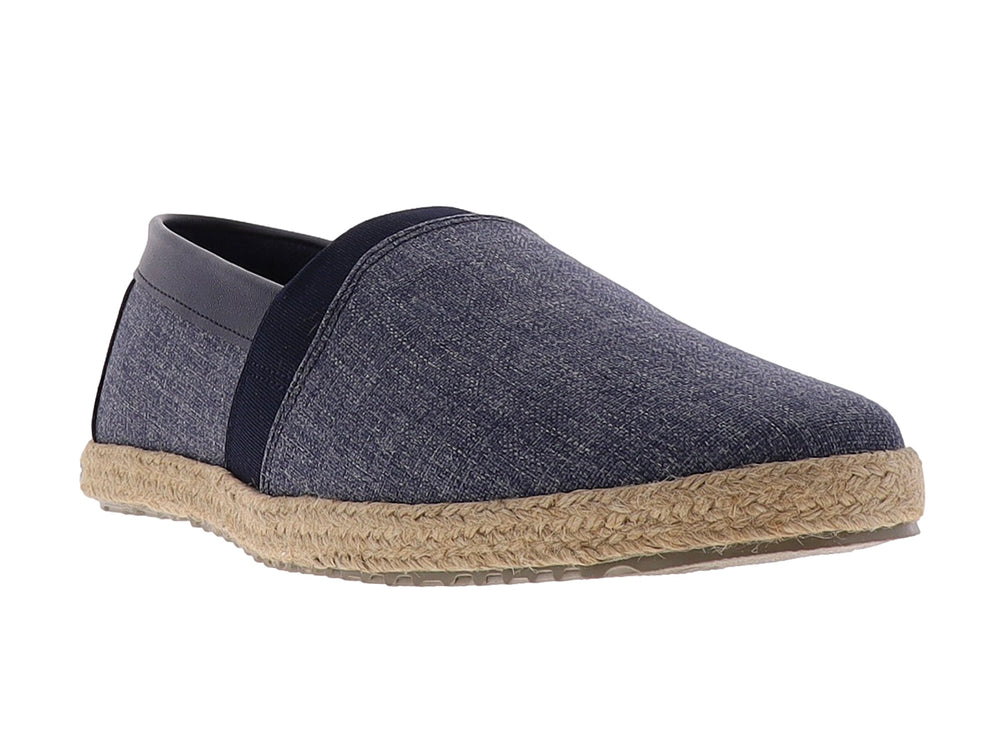 Zapato plano estilo alpargata en color azul mezclilla con detalles en negro y suela de yute trenzado.