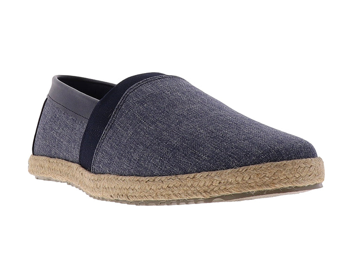 Zapato plano estilo alpargata en color azul mezclilla con detalles en negro y suela de yute trenzado.