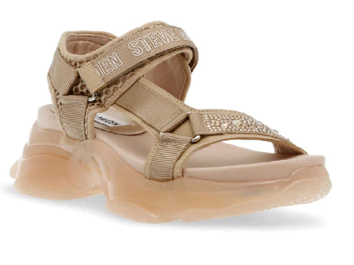 Sandalia Steve Madden color beige con plataforma gruesa, correas ajustables y detalles de pedrería en la parte frontal.