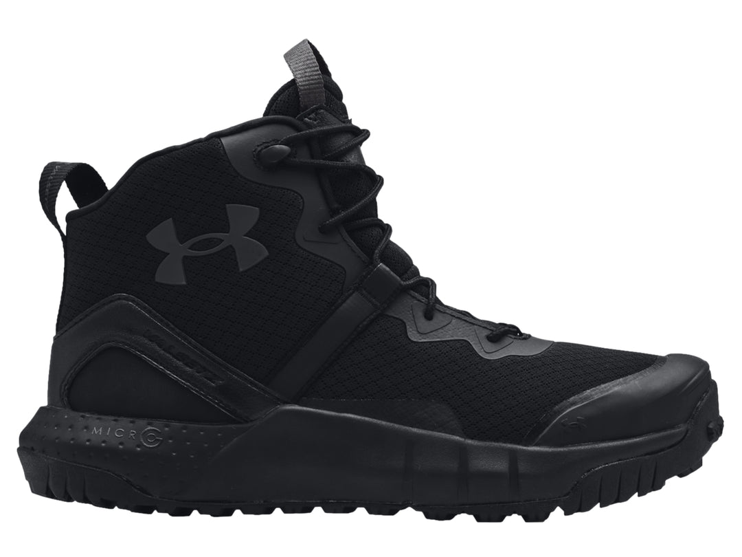 Bota deportiva Under Armour UA Micro G Valsetz Zip Mid en color negro con suela gruesa y diseño táctico.