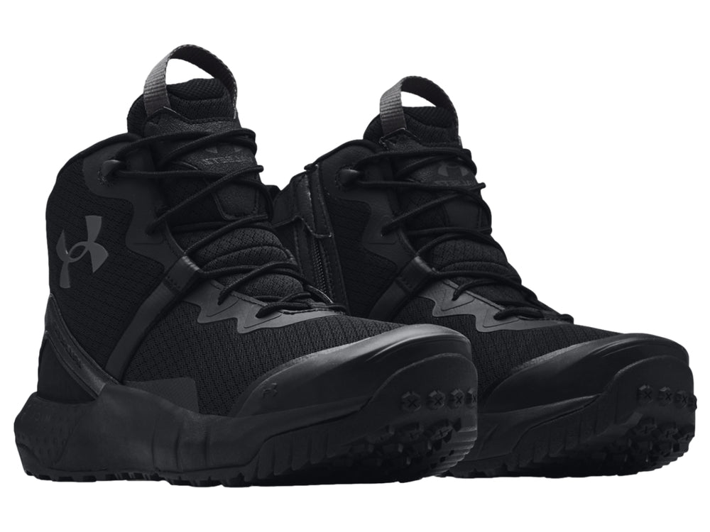 Bota deportiva Under Armour UA Micro G Valsetz Zip Mid en color negro con suela gruesa y diseño táctico.