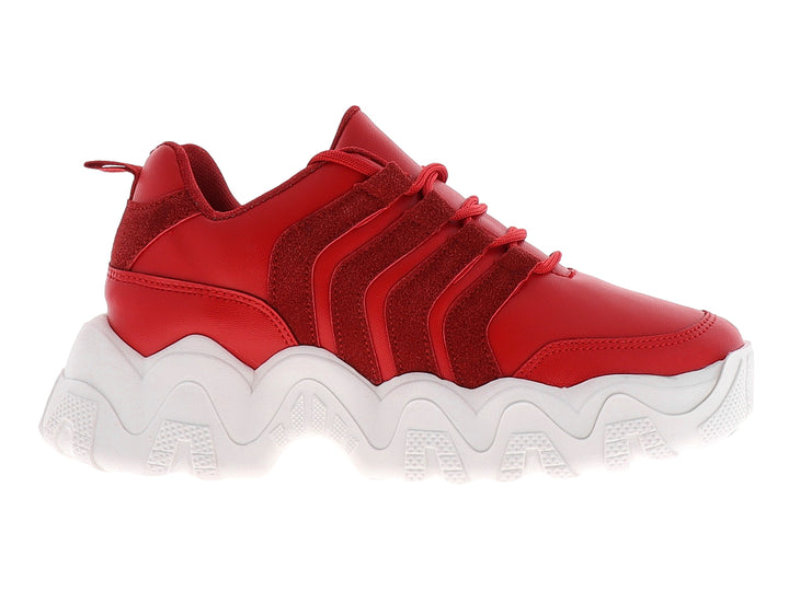 Tenis deportivos color rojo con suela blanca gruesa y diseño ondulado.