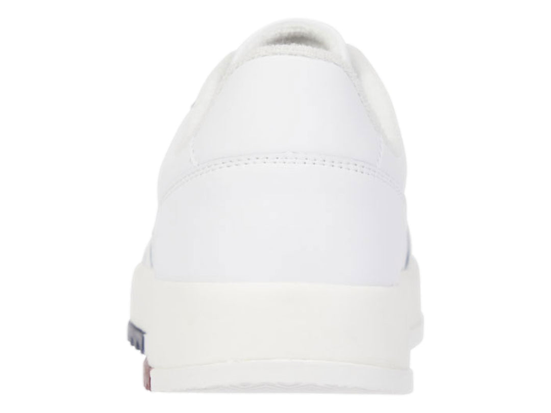 Tenis blancos de cuero Tommy Jeans con detalles en rojo y azul en la suela.