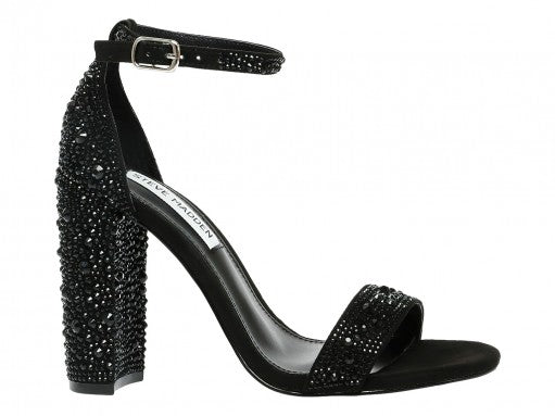 Sandalia negra de tacón grueso Steve Madden con detalles de pedrería brillante en el tacón y la correa frontal.
