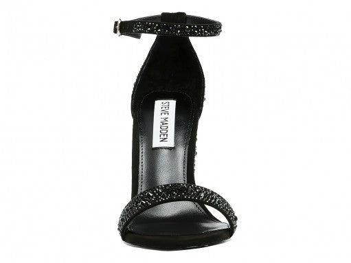 Sandalia negra de tacón grueso Steve Madden con detalles de pedrería brillante en el tacón y la correa frontal.