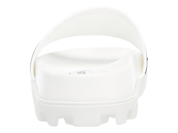 Sandalia blanca de Steve Madden con banda ancha y suela gruesa dentada.