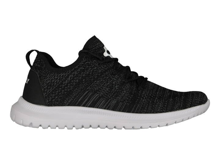 Tenis deportivos Charly color negro con suela blanca y tejido transpirable.