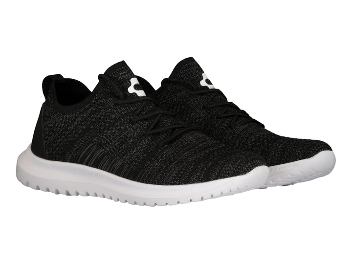 Tenis deportivos Charly color negro con suela blanca y tejido transpirable.