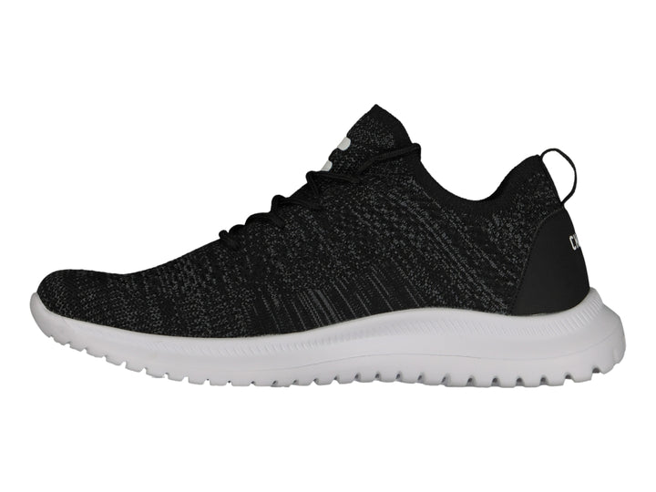 Tenis deportivos Charly color negro con suela blanca y tejido transpirable.
