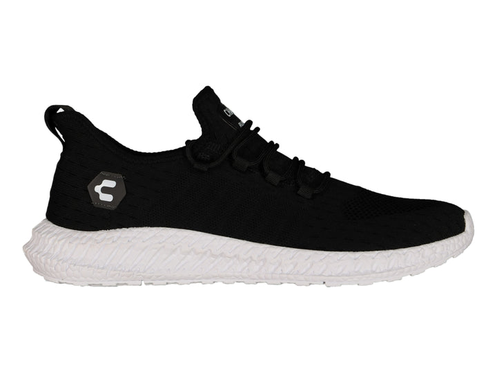 Tenis deportivos Charly color negro con suela blanca y tejido transpirable.