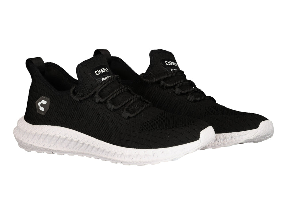 Tenis deportivos Charly color negro con suela blanca y tejido transpirable.