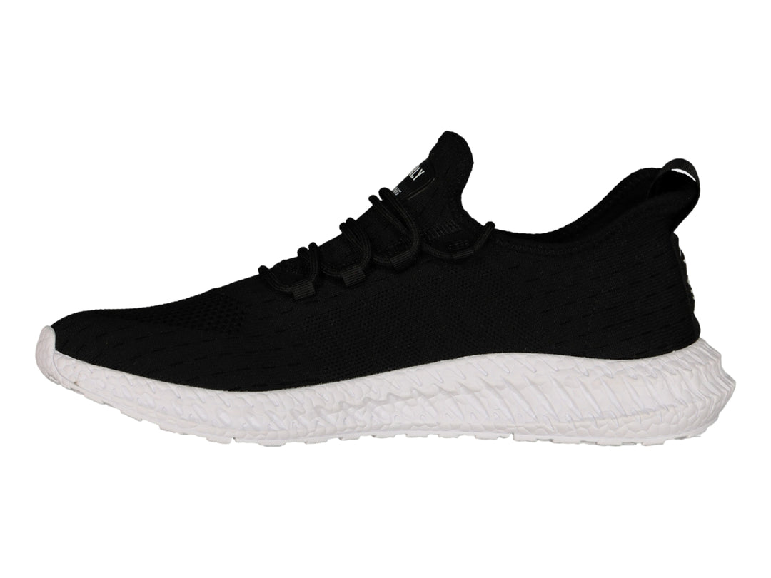 Tenis deportivos Charly color negro con suela blanca y tejido transpirable.