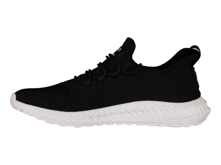 Tenis deportivos Charly color negro con suela blanca y tejido transpirable.