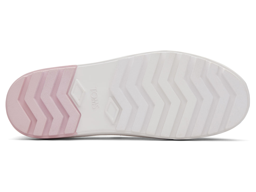 Zapato TOMS estilo slip-on con plataforma blanca y diseño en degradado de colores naranja a rosa.