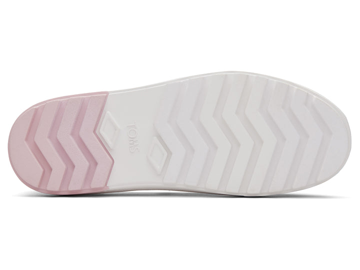 Zapato TOMS estilo slip-on con plataforma blanca y diseño en degradado de colores naranja a rosa.