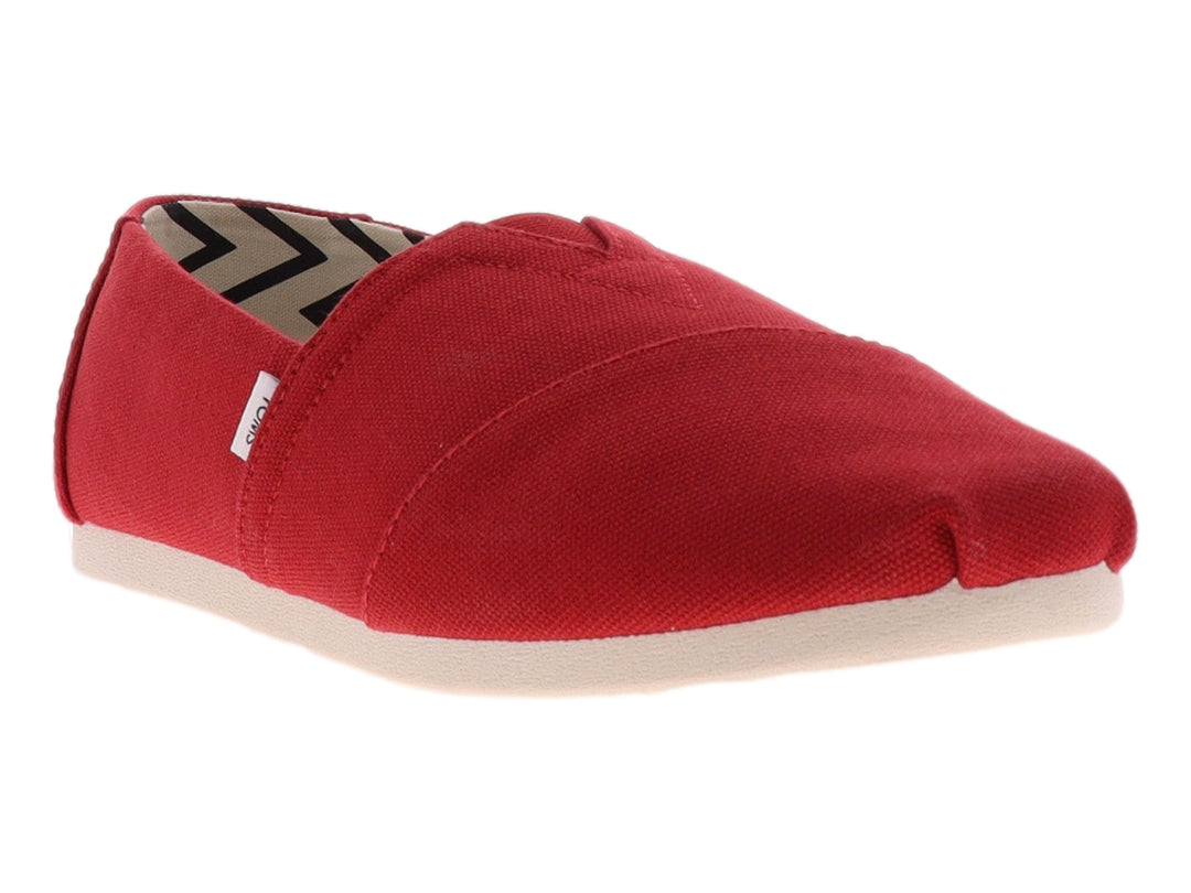 Zapato plano estilo slip-on de color rojo con suela blanca y forro interior estampado.