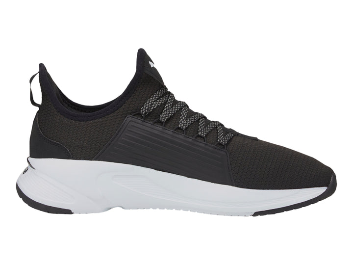 Tenis PUMA Softride Premier Slip-On en color negro con suela blanca y diseño deportivo.
