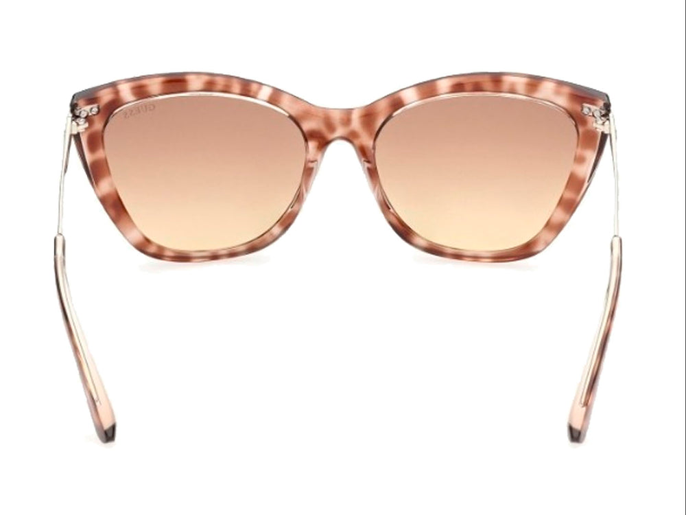 Lentes de sol GUESS para mujer con montura estilo cat-eye en color carey marrón y micas degradadas.
