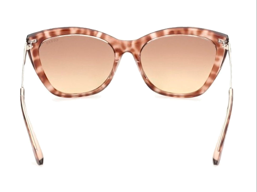 Lentes de sol GUESS para mujer con montura estilo cat-eye en color carey marrón y micas degradadas.