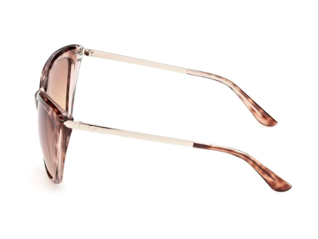 Lentes de sol GUESS para mujer con montura estilo cat-eye en color carey marrón y micas degradadas.