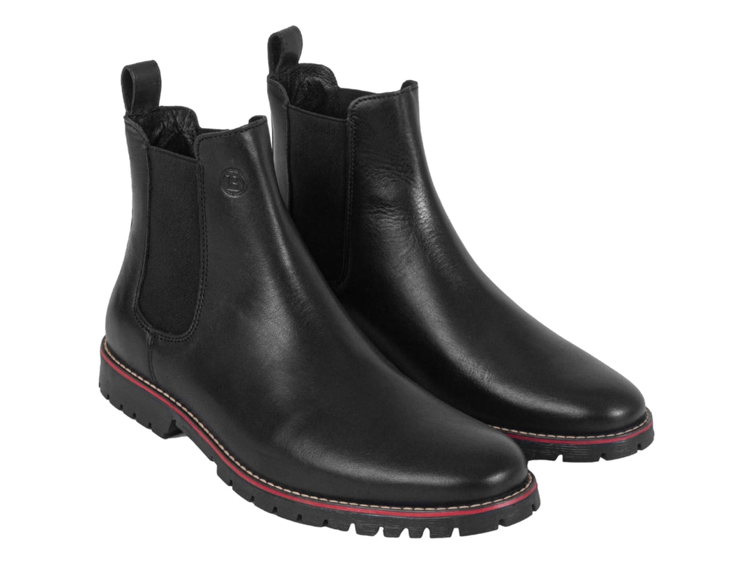 Botín negro de piel para hombre con detalle rojo en la suela y panel elástico lateral.