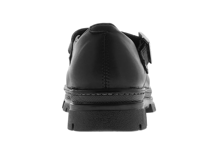 Zapato infantil de cuero negro con hebilla plateada y suela track gruesa.