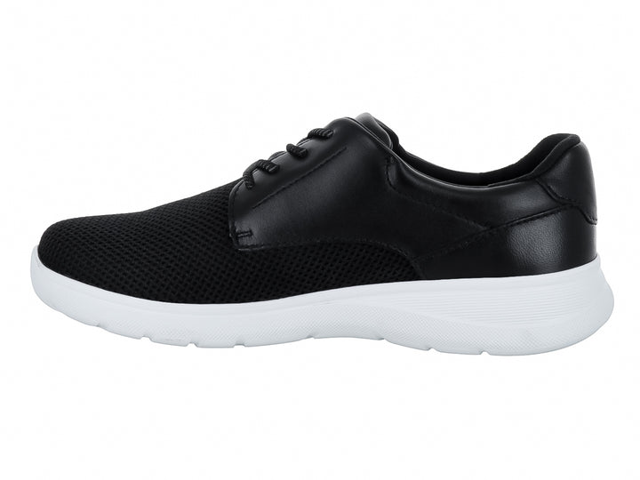 Zapato casual infantil color negro con suela blanca y cordones.