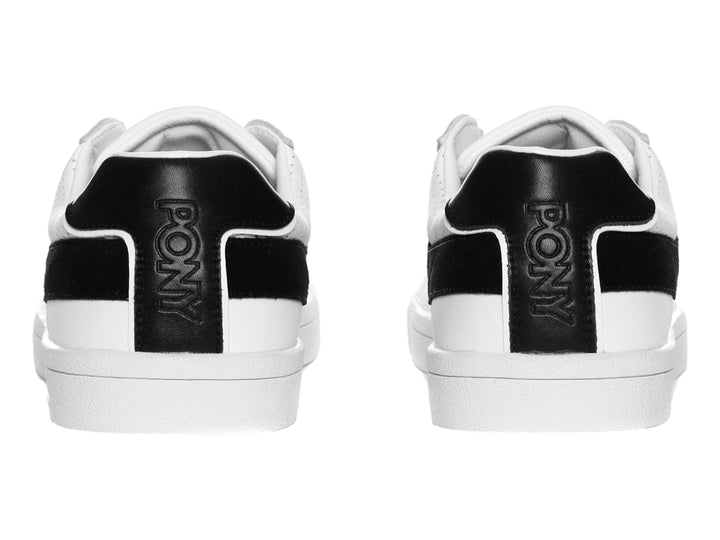 Tenis blancos PONY con franja negra en forma de V y suela blanca.