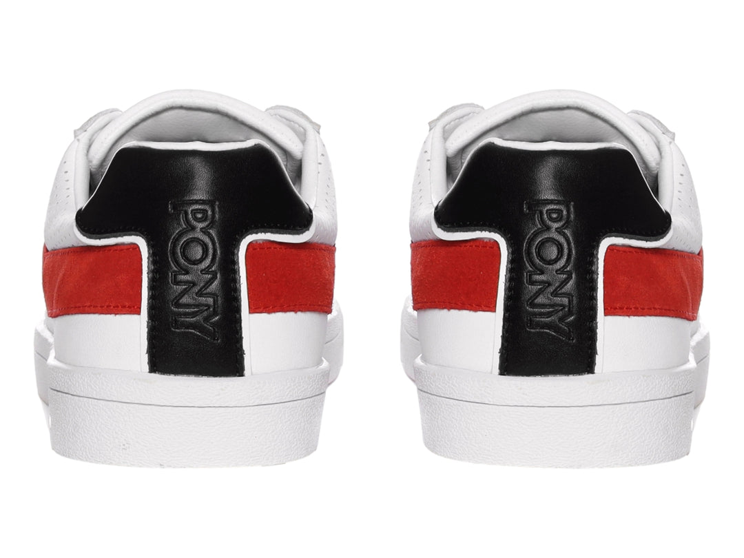 Tenis PONY blancos con una franja roja lateral y detalle negro en el talón.