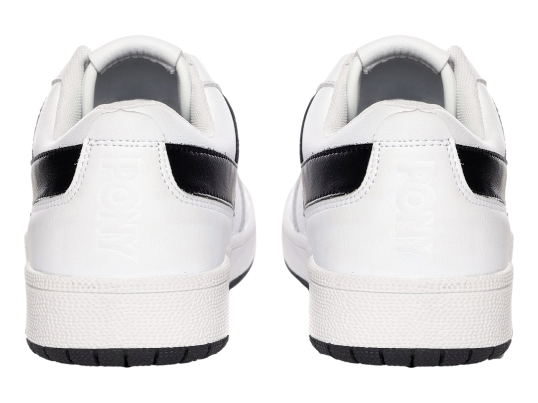 Tenis PONY City Wings blancos con franja lateral en V negra y suela negra.