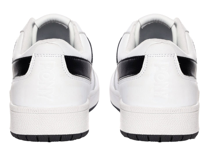 Tenis PONY City Wings blancos con franja lateral en V negra y suela negra.