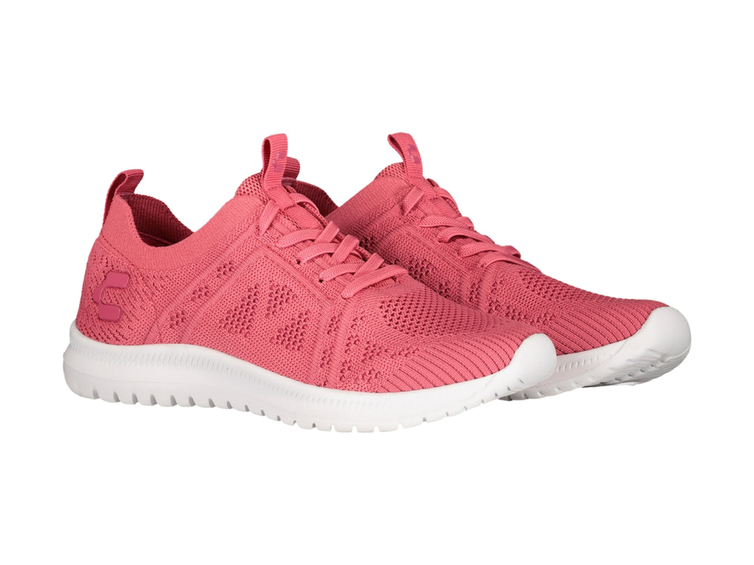 Tenis deportivos Charly color coral con suela blanca y tejido transpirable.