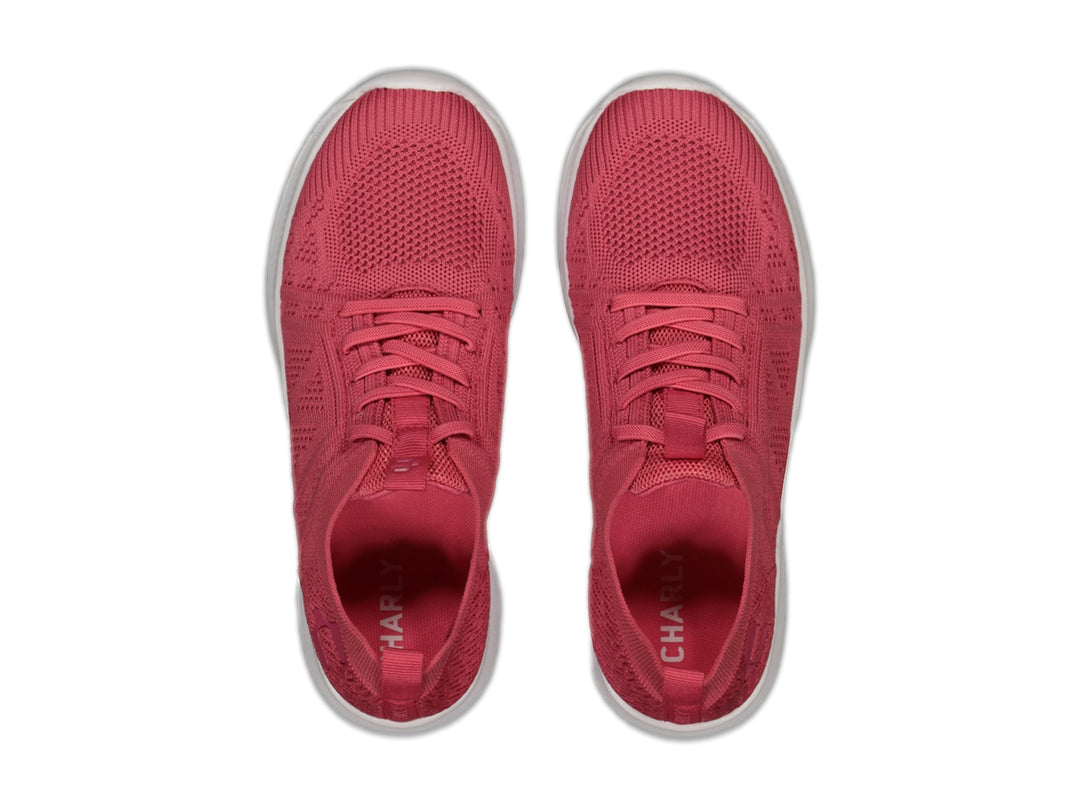 Tenis deportivos Charly color coral con suela blanca y tejido transpirable.