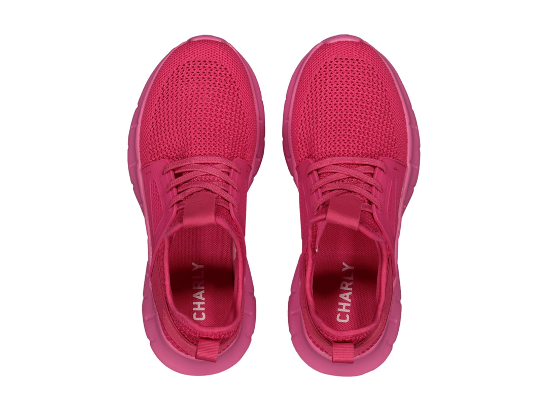 Tenis deportivos Charly color fucsia con diseño de malla y suela gruesa.