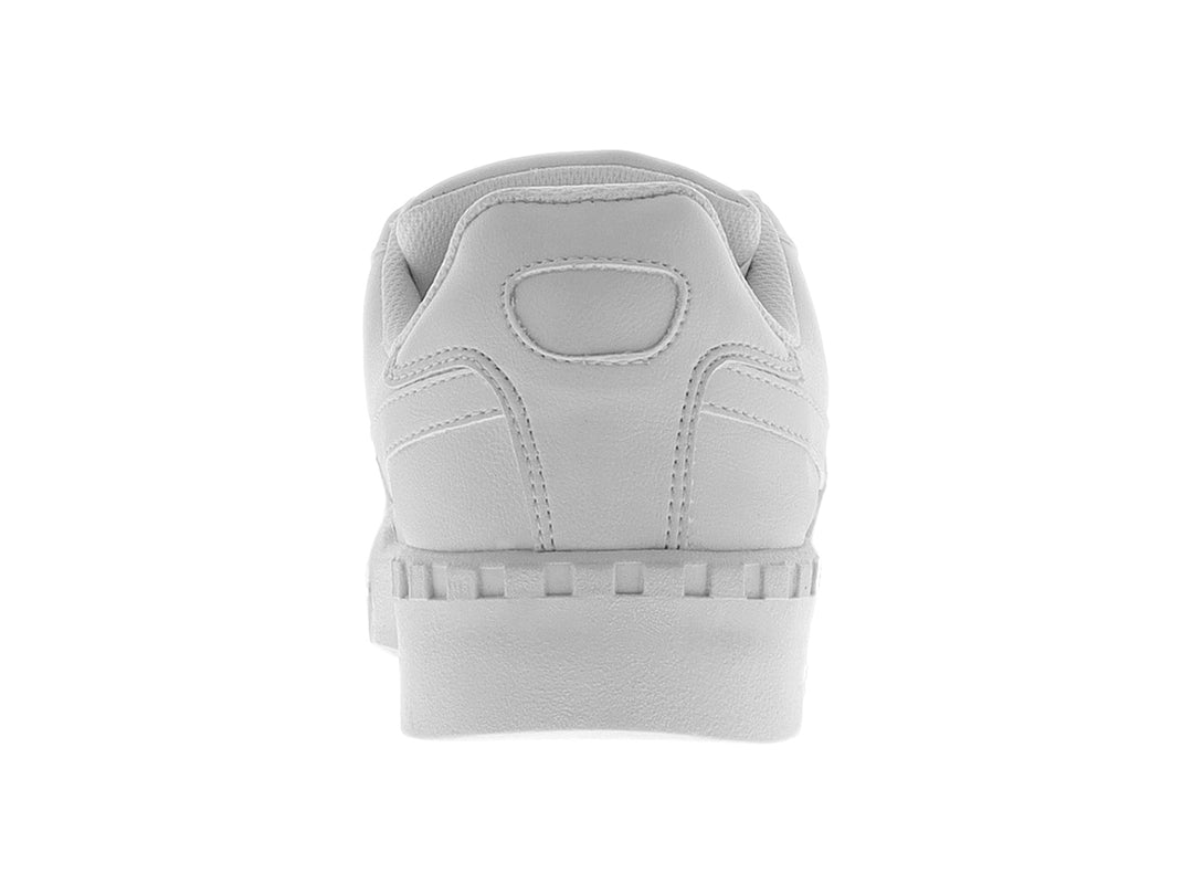 Tenis blancos PANAM con suela de plataforma gruesa y acanalada.
