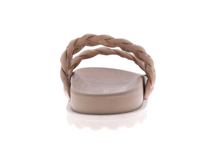 Sandalias color nude con tiras trenzadas y suela blanca de plataforma.