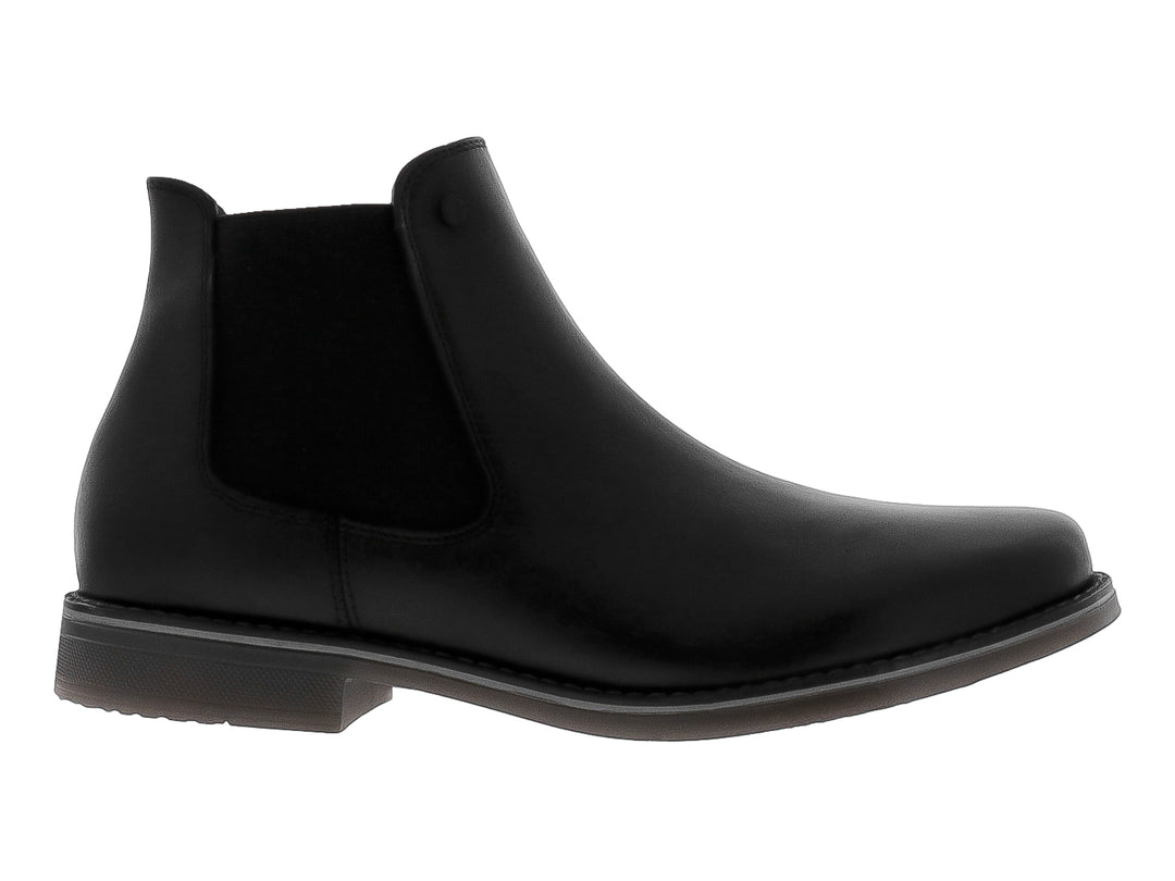 Botín estilo Chelsea de cuero negro con panel elástico lateral y suela oscura.