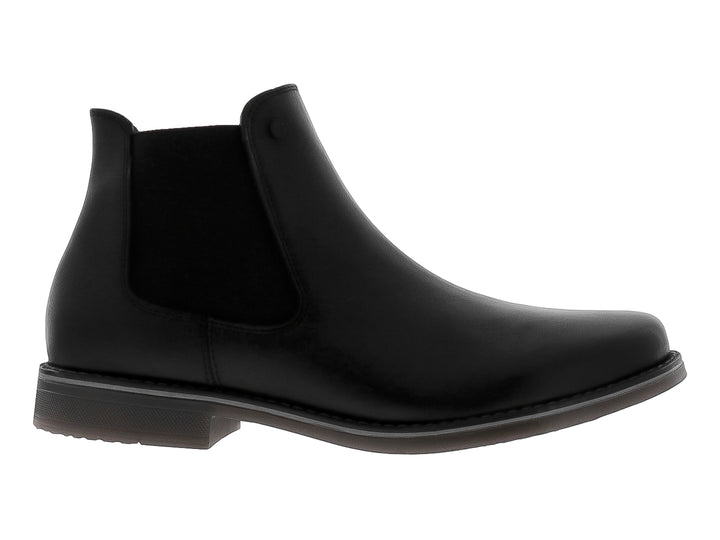 Botín estilo Chelsea de cuero negro con panel elástico lateral y suela oscura.