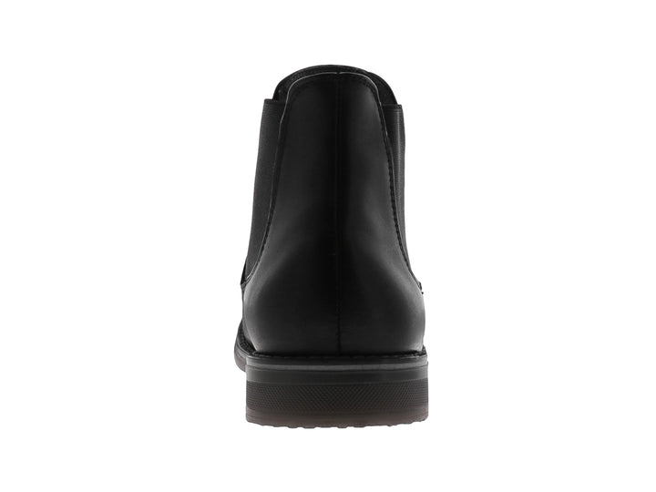 Botín estilo Chelsea de cuero negro con panel elástico lateral y suela oscura.