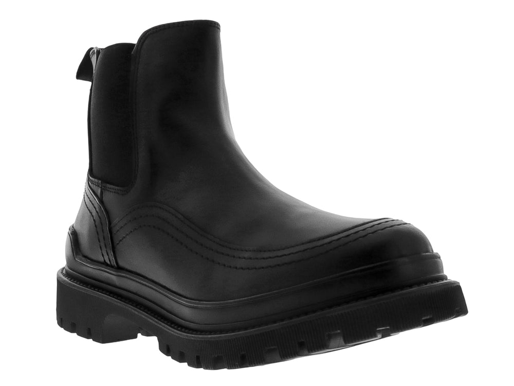 Bota negra de cuero estilo Chelsea con suela track gruesa y dentada.