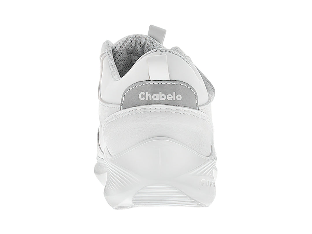 Tenis escolares blancos para niño con cierre de velcro.