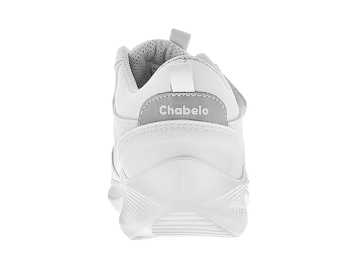 Tenis escolares blancos para niño con cierre de velcro.