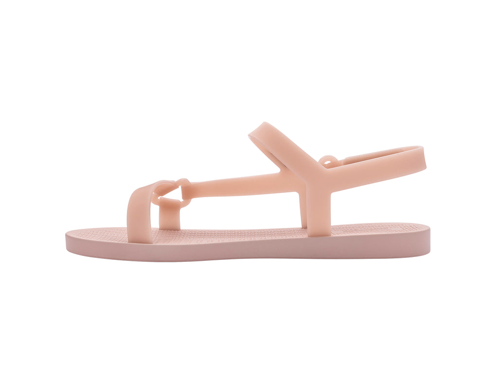 Par de sandalias Melissa color rosa oscuro con diseño de tiras y cierre en el tobillo sobre fondo blanco.