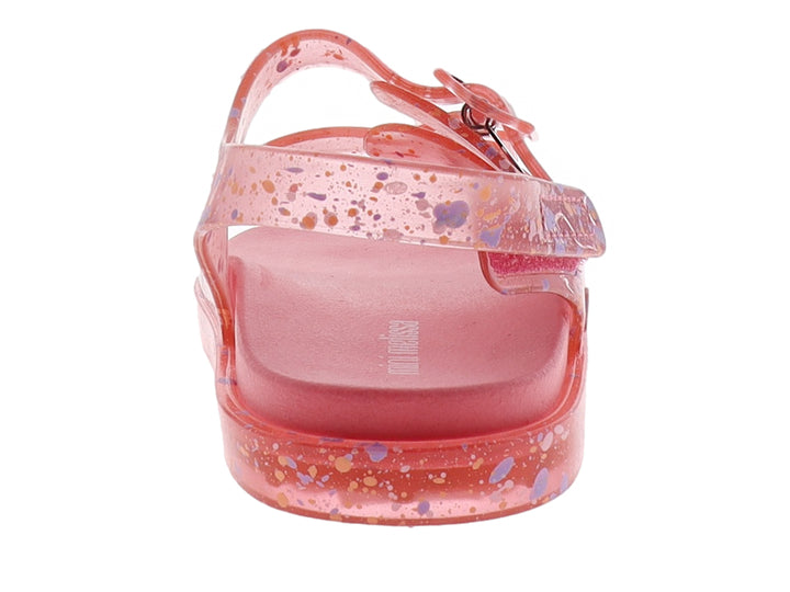 Sandalia rosa transparente para niña con detalles de colores tipo confeti y hebillas.