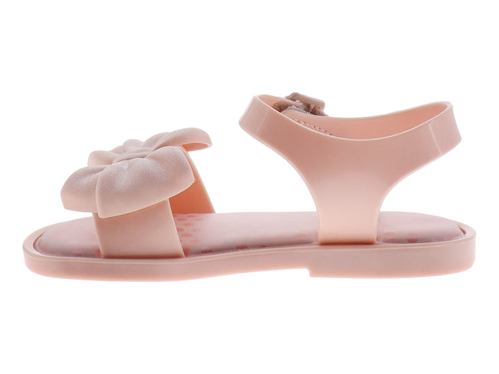 Sandalia rosa para niña con moño decorativo y correa ajustable.
