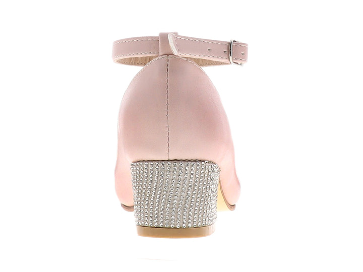 Zapato rosa con tacón cuadrado brillante y moño decorativo en la punta.