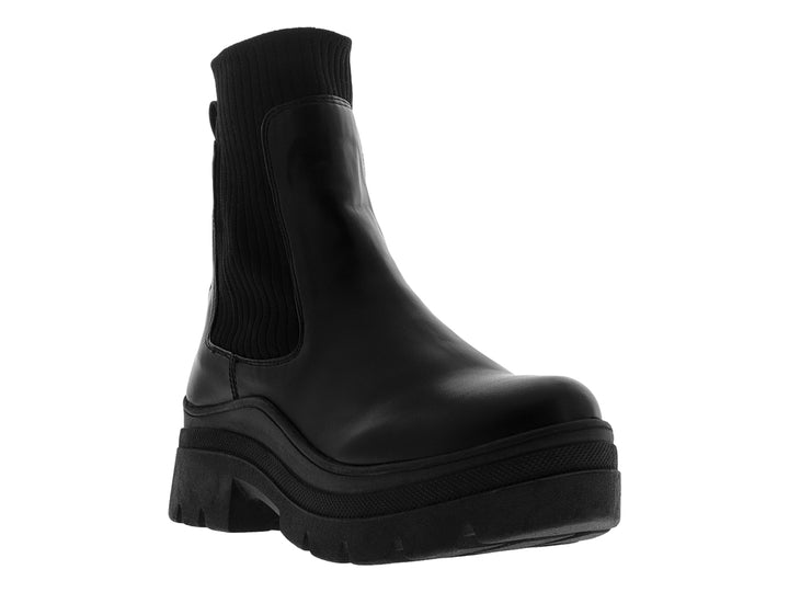 Bota negra de mujer con suela gruesa tipo track y panel elástico lateral.